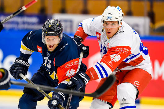 Oscar Sundh of HV71 and David Wolf of Adler Mannheim