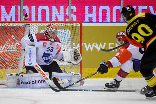 Jesper Boqvist of Brynäs shoots and Goalkeeper Atte Engren