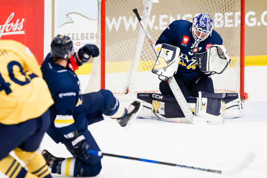 Jonas Gunnarsson goaltender of HV71 makes a save