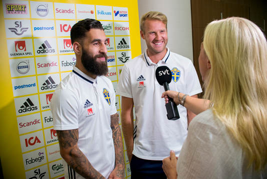 Swedish player Jimmy Durmaz (l) and Ola Toivonen meet media