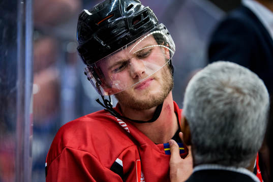 Kim Rosdahl of Malmö Redhawks gets his neck looked