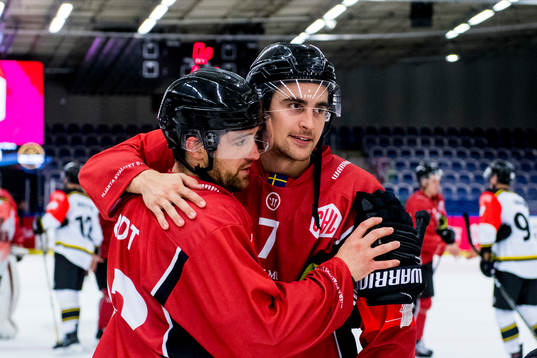 Nils Andersson of Malmö Redhawks hugs Nichlas Hardt
