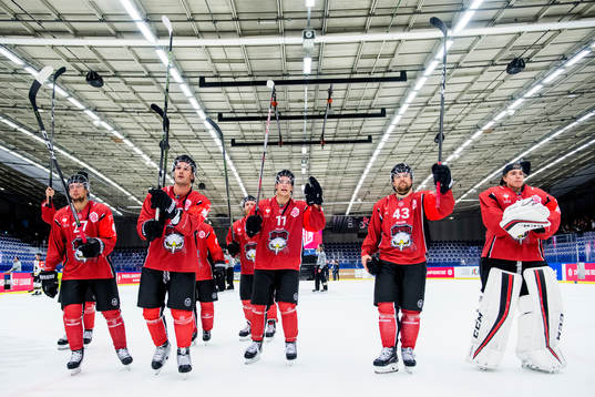 Malmö Redhawks players celebrate with the crowd