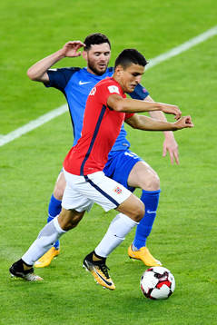 Mohamed Elyounoussi of Norway and Javid Hüseynov of
