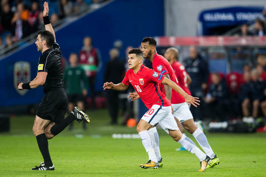 Tarik Elyounoussi and Joshua King of Norway react