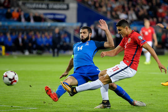 Rashad Sadygov of Azerbaijan throws himself to defend