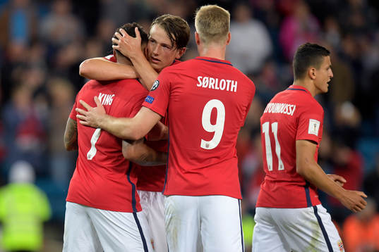 Joshua King of Norway celebrates with Sander Berge and