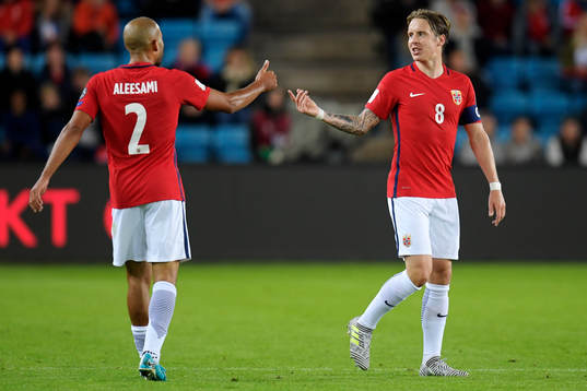 Haitam Aleesami and Stefan Johansen of Norway celebrate