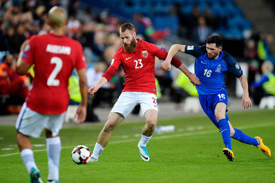 Jo Inge Berget of Norway competes for the abll with Javid