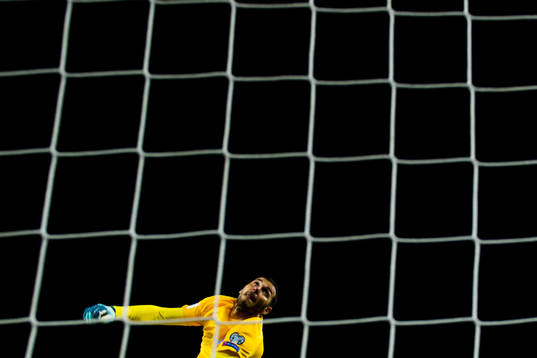 Goalkeeper Kamran Agayev of Azerbaijan with a save