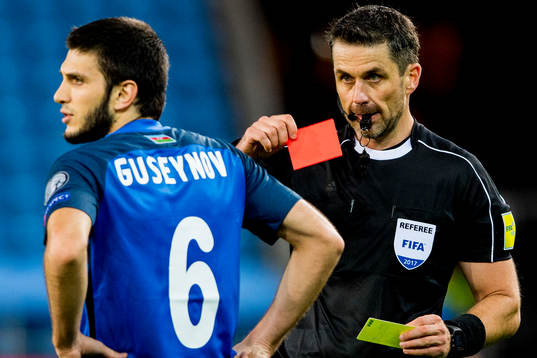 Badavi Hüseynov of Azerbaijan is shown a red card by