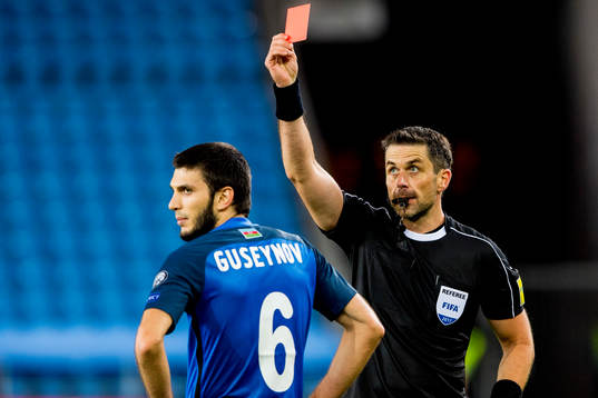 Badavi Hüseynov of Azerbaijan is shown a red card by