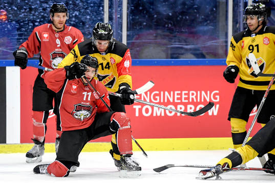 Lukas Haudum of Malmö Redhawks and Balazs Sebok of KalPa