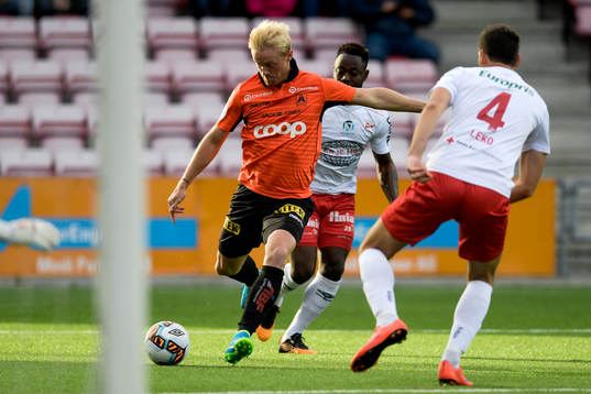 Geir André Herren of Åsane and Razak Nuhu and Mislav Leko