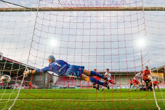 Ulrik Flo of Fredrikstad scores 1-1 behind Åsane