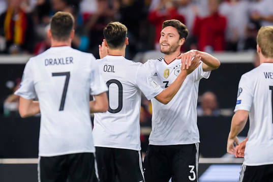 Jonas Hector of Germany celebrates with teammate Mesut Özil