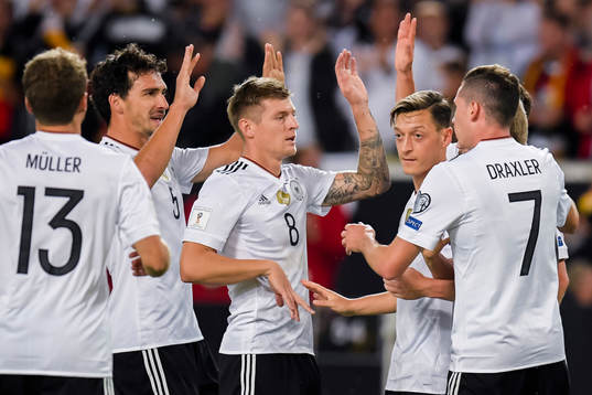Mesut Özil of Germany celebrates with teammates