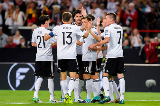 Mesut Özil of Germany celebrates with teammates