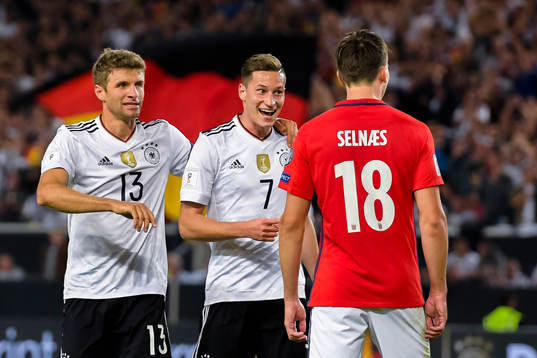 Thomas Müller and Julian Draxler of Germany celebrates the