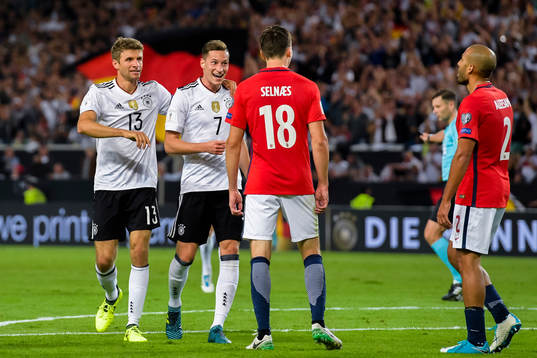 Thomas Müller and Julian Draxler of Germany celebrates the