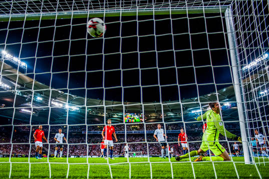 Mesut Özil of Germany scores the opening goal 1-0 behind