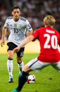 Mesut Özil of Germany and Mats Møller Dæhli of Norway