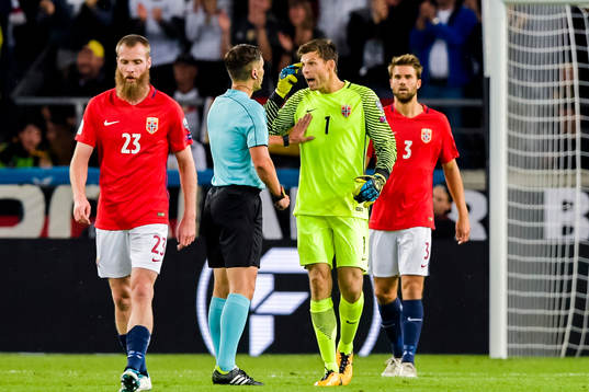 Norway's goalkeeper Rune Almenning Jarstein of Norway argue