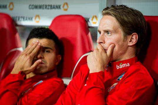 Tarik Elyounoussi and Stefan Johansen of Norway at the bench