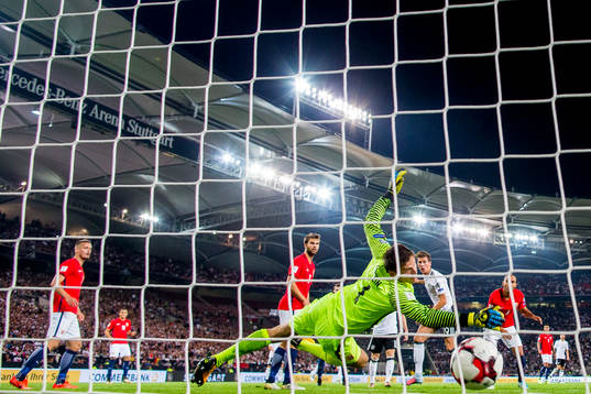 Leon Goretzka of Germany scores 5-0 behind goalkeeper Rune