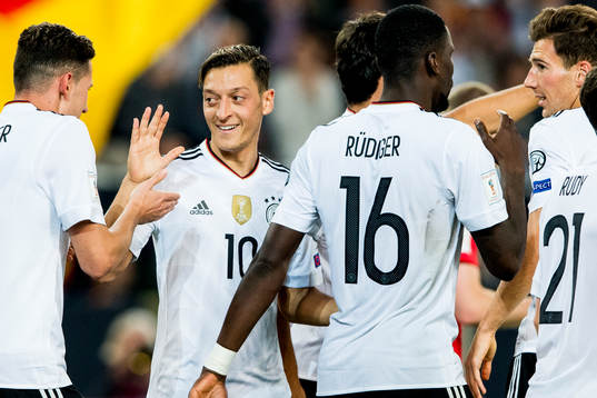 Mesut Özil celebrates with team mates