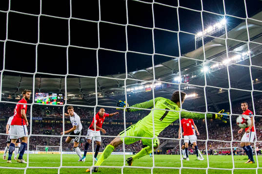 Leon Goretzka of Germany scores 5-0 behind goalkeeper Rune