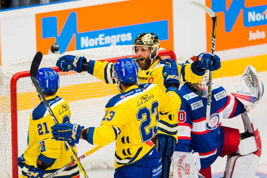 Joakim Jensen of Storhamar celebrates with his teammates