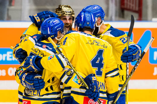 Joakim Jensen of Storhamar celebrates with his teammates