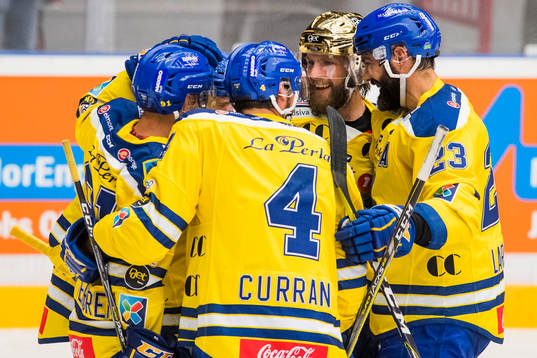 Joakim Jensen of Storhamar celebrates with his teammates