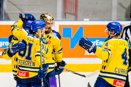 Joakim Jensen of Storhamar celebrates with his teammates