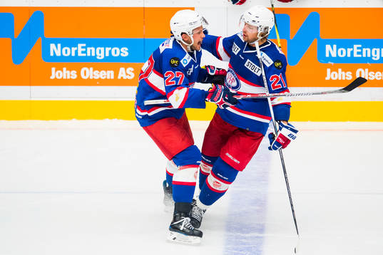 Morten Ask of Vålerenga celebrates with his teammate