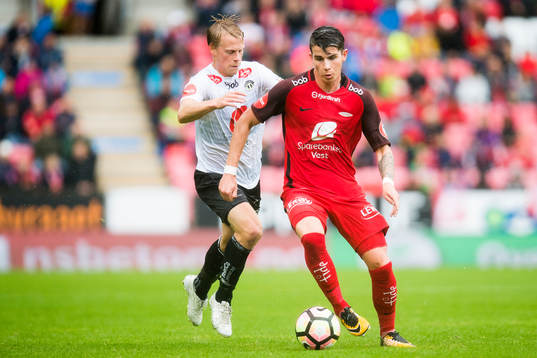 Eirik Schulze of Sogndal competes for the ball with Vidar