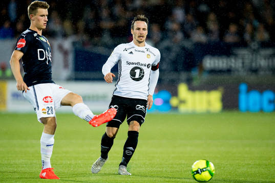 Marius Høibråten of Strømsgodset and Mike Jensen of
