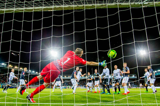 Nicklas Bendtner of Rosenborg scores 0-1 behind goalkeeper
