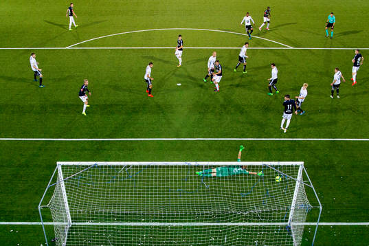 Francisco Junior of Strømsgodset hits the post behind