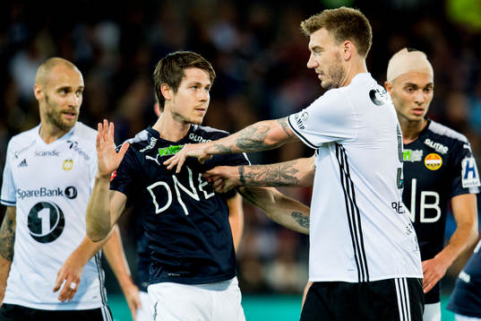 Nicklas Bendtner of Rosenborg gives Lars Vilsvik of