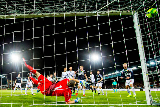 Nicklas Bendtner of Rosenborg scores 0-1 behind goalkeeper