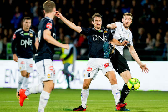 Henning Hauger of Strømsgodset and Nicklas Bendtner of