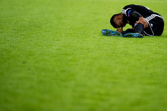 Samuel Adegbenro of Rosenborg lies down with an injury
