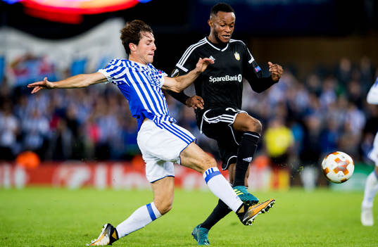 Alvaro Odriozola of Real Sociedad and Samuel Adegbenro of