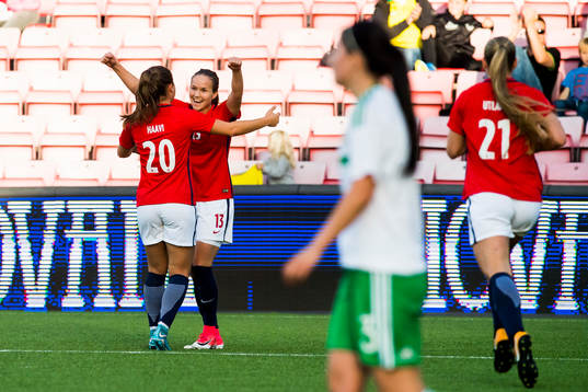 Guro Reiten of Norway celebrates with her teammates