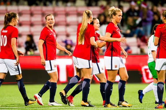 Guro Reiten of Norway celebrates with her teammates