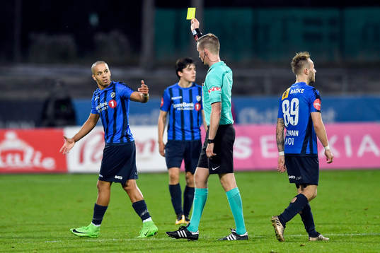 Ahmed el Amarani of Stabæk is shown a yellow card