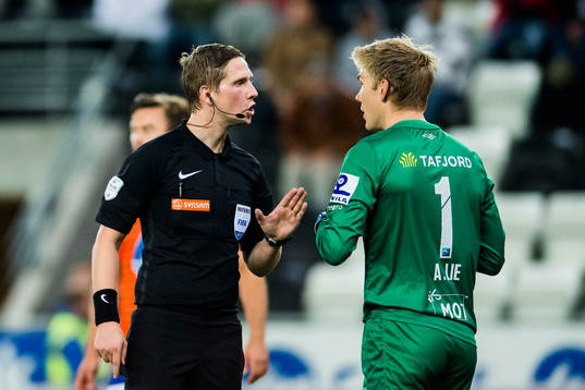Goalkeeper Andreas Lie of Aalesund discuss with The Referee