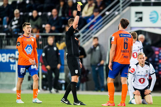 Kaj Ramsteijn of Aalesund is shown a yellow card by The